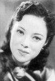 Yoshiko made her debut as an actress and singer in the 1938 film Honeymoon Express. She was billed as Li Xianglan, pronounced Ri Kōran in Japanese. The adoption of a Chinese stage name was prompted by the Film company's economic and political motives—a Manchurian girl who had command over both the Japanese and Chinese languages was sought after. From this she rose to be a star and Japan-Manchuria Goodwill Ambassadress. Though in her subsequent films she was almost exclusively billed as Li Xianglan; she indeed appeared in a few as 'Yamaguchi Yoshiko.' Many of her films bore some degree of promotion of the Japanese national policy (in particular pertaining to the Greater East Asia Co-prosperity Sphere ideology).<br/><br/>

At the end of World War II, she was arrested by Chinese government for treason and collaboration with the Japanese. However, she was cleared of all charges, and possibly the death penalty, since she was not a Chinese national, and thus the Chinese government could not try her for treason. And before long in 1946, she settled in Japan and launched a new acting career there under the name Yoshiko Yamaguchi.<br/><br/>

In 1974, she was elected to the House of Councillors (the upper House of the Japanese parliament), where she served for 18 years (three terms).