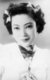 Yoshiko made her debut as an actress and singer in the 1938 film Honeymoon Express. She was billed as Li Xianglan, pronounced Ri Kōran in Japanese. The adoption of a Chinese stage name was prompted by the Film company's economic and political motives—a Manchurian girl who had command over both the Japanese and Chinese languages was sought after. From this she rose to be a star and Japan-Manchuria Goodwill Ambassadress. Though in her subsequent films she was almost exclusively billed as Li Xianglan; she indeed appeared in a few as 'Yamaguchi Yoshiko.' Many of her films bore some degree of promotion of the Japanese national policy (in particular pertaining to the Greater East Asia Co-prosperity Sphere ideology).<br/><br/>

At the end of World War II, she was arrested by Chinese government for treason and collaboration with the Japanese. However, she was cleared of all charges, and possibly the death penalty, since she was not a Chinese national, and thus the Chinese government could not try her for treason. And before long in 1946, she settled in Japan and launched a new acting career there under the name Yoshiko Yamaguchi.<br/><br/>

In 1974, she was elected to the House of Councillors (the upper House of the Japanese parliament), where she served for 18 years (three terms).